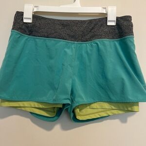 Running shorts with built in compression